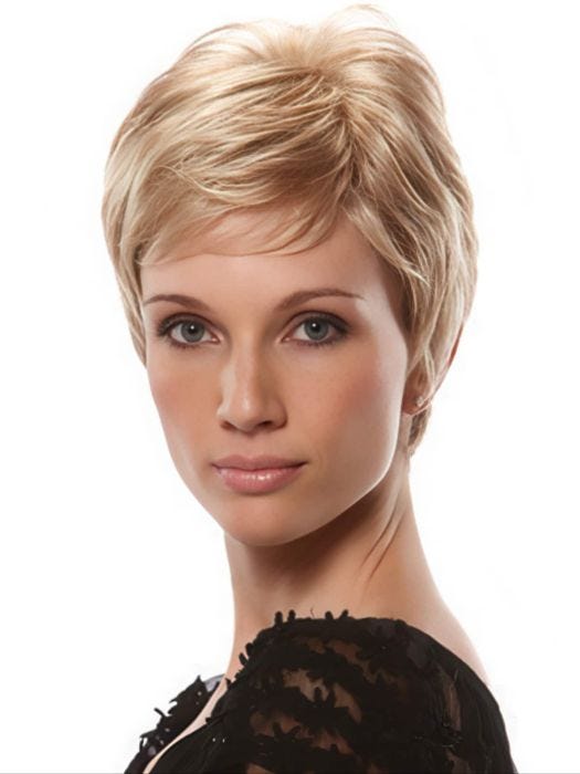 Woman in short blonde pixie wig with bangs and layers