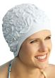 Woman in white textured old fashioned rubber swim cap