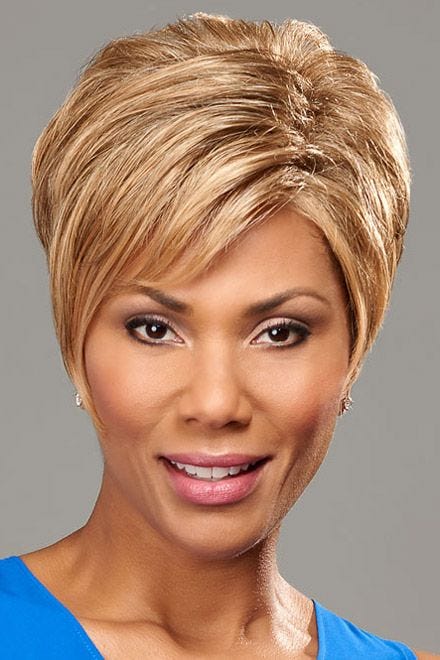 Black woman in a light brown pixie wig with longer layers on top and side bangs