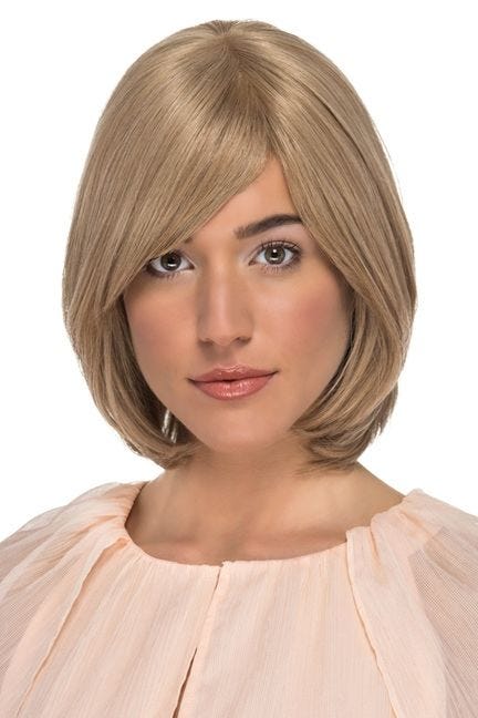 Woman in a shoulder length layered bob wig with long side bangs