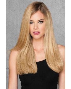 woman in 20" reddish blonde hair extensions attached to her hair