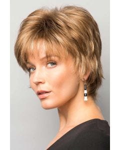 Woman in a shaggy layered short red blonde wig with wispy bangs
