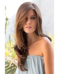 Woman in an extra long medium brown wig with long layers