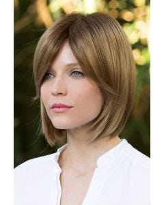 Woman in blonde straight bob wig with blunt cut and side bangs