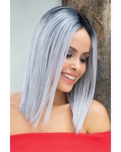 Woman in a straight past the shoulders silver blunt cut wig