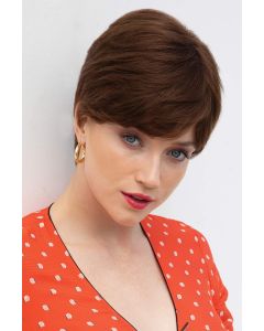 Woman in a long medium auburn classic human hair pixie wig