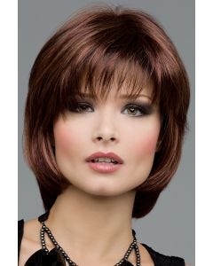 Woman in a short medium auburn bob wig with shaggy bangs and short face framing layers