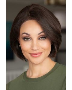 Woman in a chin length medium blonde curled-under straight bob wig
