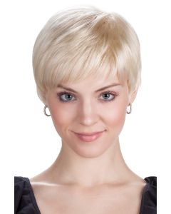 Woman in a platinum blonde pixie wig with short fringe bangs