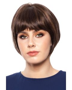 Woman in a chin length medium brown rounded bob wig with blunt bangs