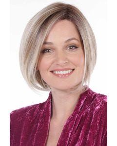 Woman in a chin length light blonde bob wig with dark roots
