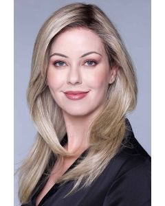 Woman in an extra long light blonde lace front straight wig