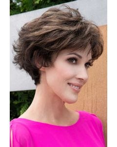 Woman in long light red textured pixie wig with longer layers at the top