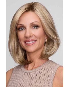 Woman in a shoulder length blonde blunt bob wig with long layers