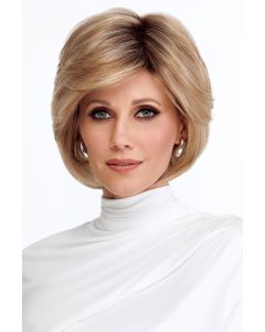 Woman in a long layered light brown pixie wig with side bangs