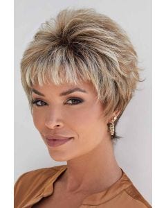 Woman in a blonde pixie wig with longer layering on top and short fringe bangs