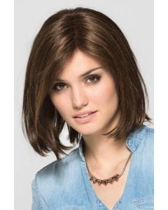 Woman in a shoulder length dark brown blunt lace front wig