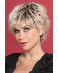 Woman in a long messy light blonde pixie wig with textured layers