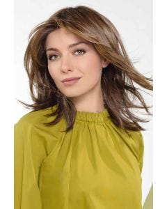 Woman in a past the shoulders medium brown long layered lace front wig
