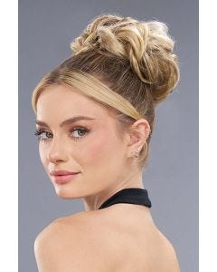 Woman in a 4" dark brown curly scrunchie bun hair piece