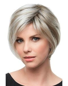 Woman in a petite layered chin length blonde rounded bob wig with bangs