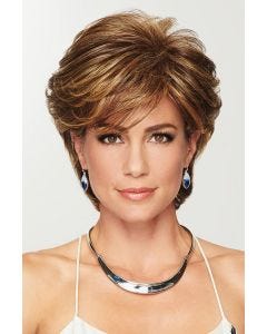 Woman in a textured medium brown pixie wig with longer layers on top