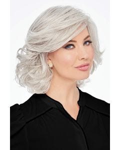 Woman in a shoulder length silver curly wig with long side bangs
