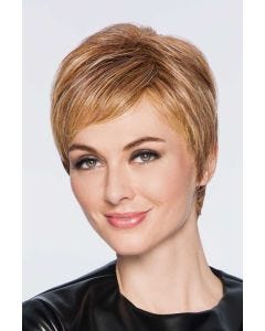 Woman in a layered short light auburn pixie wig with short side fringe bangs