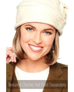 Woman in a blonde straight bob style halo hair piece under a beige hat