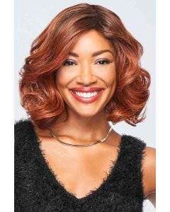 Afro American woman in a shoulder length reddish brown curly wig