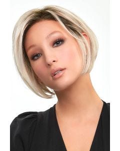 Woman in a petite chin length light blonde angled lace front wig