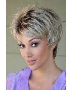 Woman in a choppy light brown pixie wig with fringe bangs