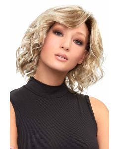 Woman in a shoulder length light blonde curly lace front wig