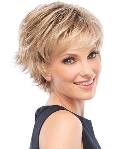 Woman in spiky blonde pixie cut wig with longer layers along the top and wispy side swept bangs