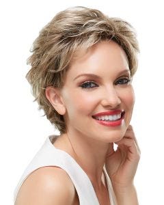 Woman in a classic ash blonde pixie wig with more fullness on top