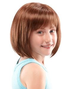 Young girl in short auburn children's rounded bob wig with blunt bangs