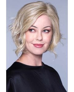 Woman in a shoulder length light blonde curly layered lace front bob wig