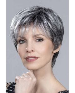 Woman in an edgy light blonde layered lace front pixie wig with bangs