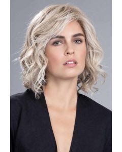Woman in a 6.5" to 11" curly light blonde hair topper for thinning hair