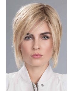 Woman in an 8.5" light warm blonde wiglet hair topper for thinning hair
