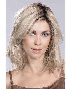 Woman in a shoulder length platinum straight lace front wig