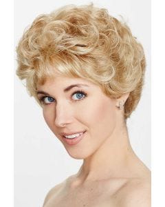 Woman in a short curly warm blonde wig