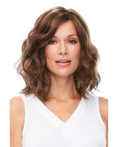 Woman in a petite shoulder length medium brown wavy lace front wig
