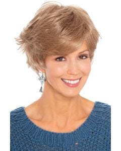 Woman in sassy, flippy, layered short blonde wig with bangs