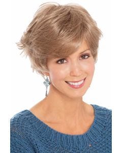 Woman in sassy, flippy, layered short blonde wig with bangs