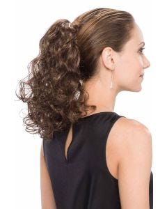 Woman in a 14" curly medium brown clip in ponytail hairpiece