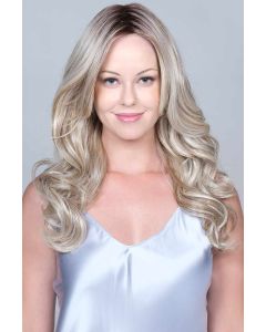 Woman in an extra long medium blonde curly lace front wig