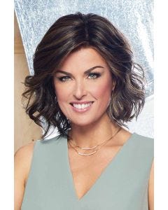 Woman in a wavy shoulder length dark brown lace front wig