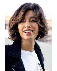 Woman in a chin length brown bob wig with long layers around the face