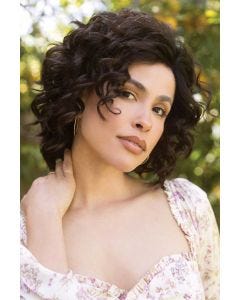 Woman in a shoulder length curly dark brown lace front layered wig